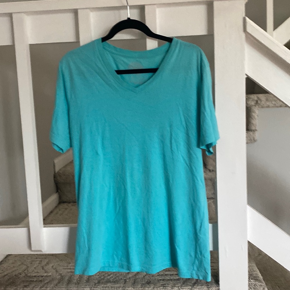 Here, bright turquoise T-shirt
